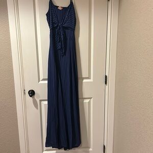 Navy jumpsuit with white stripes, tie-front, wide-leg,and a cut-out back